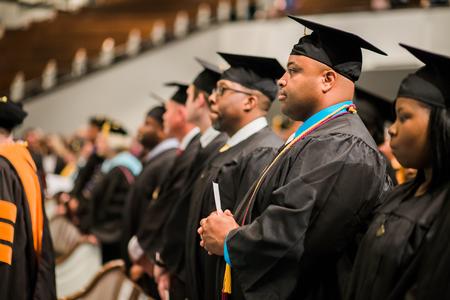 Andre Marshall, BSOL graduate, stands with his classmates at the beginning of Summer Commencement.  - Photo by Kristi McMurry Woody