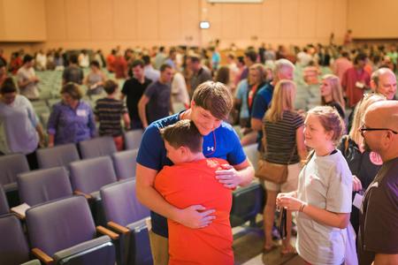 New students say goodbye to their families after a long day of moving in and getting settled for Welcome Week. - Photo by Kristi McMurry Woody