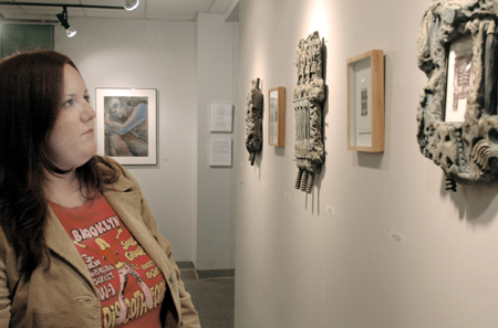 Rachel Evans Morris takes in the faculty art work that was on display in the art gallery during the month of November. - Photo by Lindsay Stavish