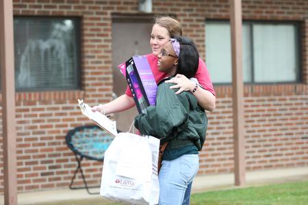 A new student meets her resident advisor during new student move-in day.  - Photo by Kristi McMurry Woody