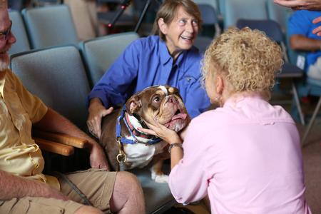 Guests in chapel greet Buster during Welcome Week.  - Photo by Kristi McMurry Woody