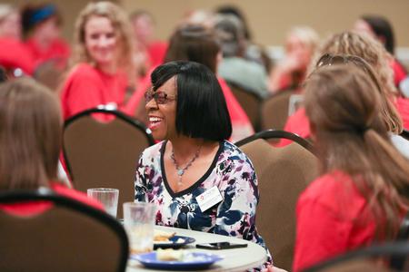 Rhonda Hudson, professor of social work and director of BSW programs, laughs with new students during the Dinner with Your Department event. - Photo by Kristi McMurry Woody