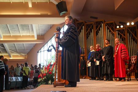 Web Drake, associate professor of communication arts and 2015-2016 faculty member of the year, looks out at staff, faculty, and students in the G.M. Savage Memorial Chapel at the beginning of Convocation.  - Photo by Morgan Morfe