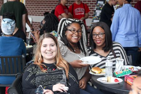 Caitlin Douglas, junior special education major, Marqueisha Walker, junior social work major, and Diamond Sparks, senior psychology major enjoy the MOSAIC cookout on the Bowld patio.  - Photo by Morgan Morfe