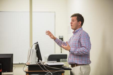 Duncan Nicol, instructor of marketing, gives a lecture to his marketing students.  - Photo by Kristi McMurry Woody