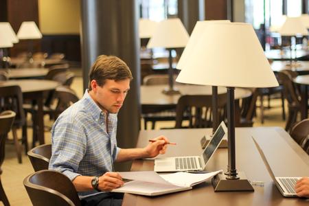Ben Melton, senior Cell & Molecular Biology major prepares for Molecular Biology lab in the Logos.  - Photo by Morgan Morfe