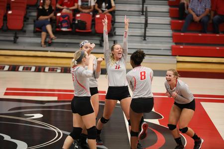 The Lady Bulldogs volleyball team celebrates a point during a match against CBU. - Photo by Kristi McMurry Woody