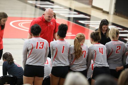 Head volleyball coach Darren McClure talks to the Lady Bulldogs during a timeout.  - Photo by Kristi McMurry Woody