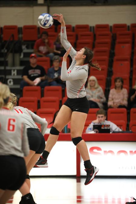 Sophomore Christa Karns goes up for a kill during a volleyball match against CBU. - Photo by Kristi McMurry Woody