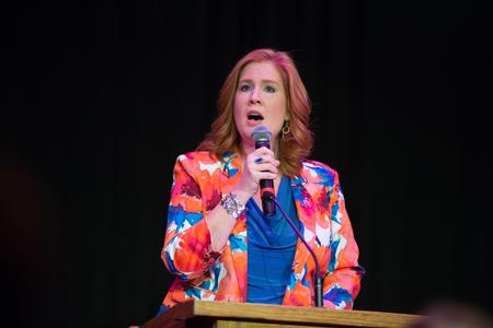 Julie Glosson, professor of language, provides special music during the Remember Me Commemorative Walk event honoring loved ones lost to homicide. - Photo by Kristi McMurry Woody