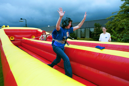 Christen Tucker, sophomore Christian Studies major, has fun with the bungee cord at Fall Fest 2002. - Photo by Kristen Hiller
