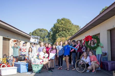 The Ladies of Chi Omega get ready to reorganize the storage unit for the Boys & Girls Club in Humboldt on Campus & Community Day.  - Photo by Morgan Morfe