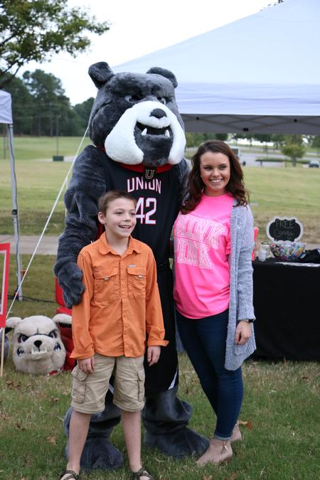 Guests of Union Night pose for a photo with Buster during the evening's festivities. - Photo by Elizabeth Wilson