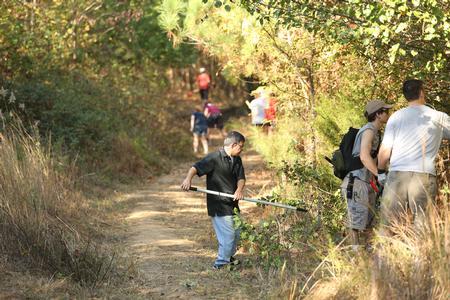 Don Van, professor of engineering, helps clear trails during Campus and Community Day.  - Photo by Kristi McMurry Woody
