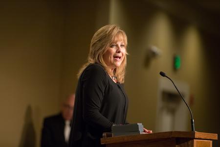 Beverly Absher, chair of the department of continuing studies, accepts the Distinguished Service Award on behalf of the late Keith Absher during the Meritorious Service Awards Banquet.  - Photo by Kristi McMurry Woody
