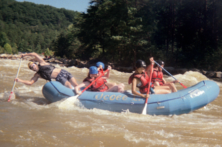 Laura Hicks, Eunice Sung, Derek Wood and Bambi Chao enjoy the Ocoee rafting trip as their guide steers them into safer waters. The trip provided an opportunity for studentsto get away from campus and jump into an adventure. - Photo by Jonathan Blair