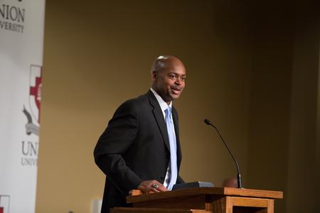 Dexter Williams ('00) accepts his award for distinguished achievement in athletics during the Meritorious Service Awards Banquet. - Photo by Kristi McMurry Woody