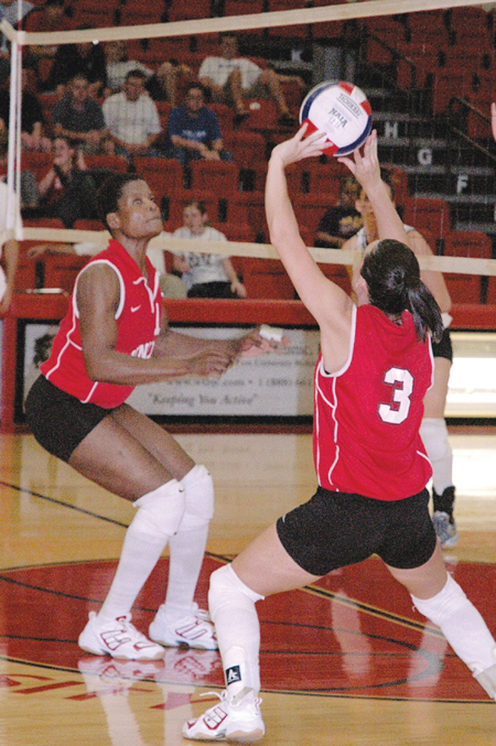 Senior Gladys Wandera waits for Senior Nicole
Garber’s set in a game against Cumberland. - Photo by Lauren Crane