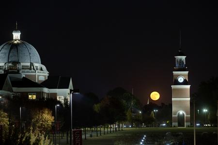 The "super moon" rises behind Miller Tower. - Photo by Kristi McMurry Woody