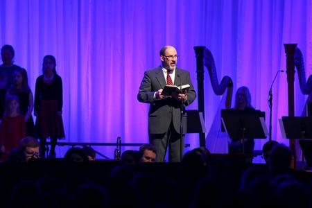 Scott Huelin, director of the honors community, reads scripture during A Union Christmas.  - Photo by Kristi McMurry Woody