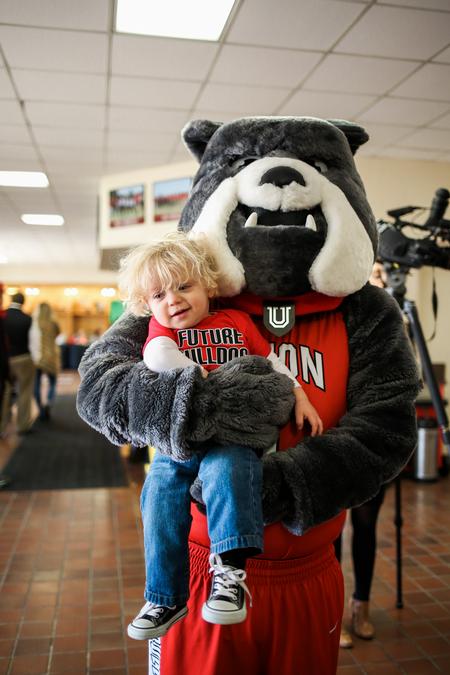 Buster the Bulldog poses with a future bulldog outside the Fred Delay Gymnasium. - Photo by Kristi McMurry Woody