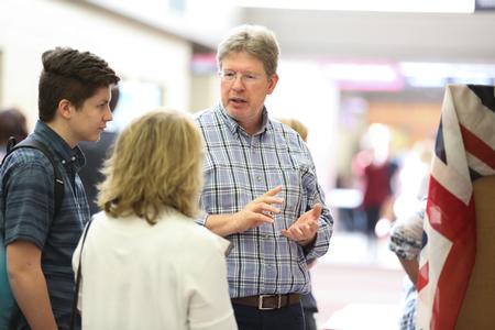 Mark Bolyard, professor of biology and department chair, tells guests about an upcoming study abroad opportunity at the Study Abroad Fair. - Photo by Kristi McMurry Woody