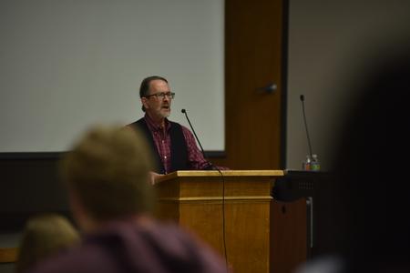 During the creative writing workshop, held in Harvey Hall, Bill Brown, reads a collection of his poetry to students, faculty and guests of the workshop.  - Photo by Elizabeth Wilson