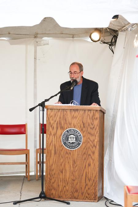Terry McRoberts, university professor of music, reads from the Bible during the scripture reading marathon at Miller Tower. - Photo by Kristi McMurry Woody