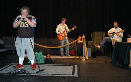 Seniors Jonathan Blair, Micah Moyers and Patrick Myers performed at Alpha Psi Omega's Cafe Bongo. - Photo by Amanda Herron