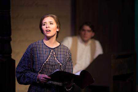 Jo March, portrayed by Tatum Sheppard, sings during a musical production of Little Women.  - Photo by Kristi McMurry Woody