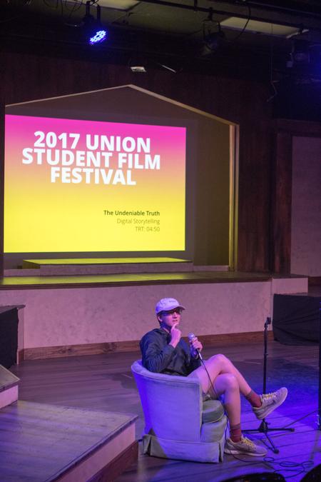 Alex Russell, sophomore digital media communications major, answers questions about the film he directed at the Student Film Festival.  - Photo by Morgan Morfe