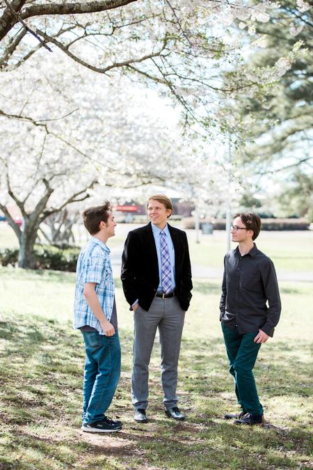 Jay Beavers, assistant professor of English, talks with Ian Malone and Josh Welsch after class.  - Photo by Kristi McMurry Woody