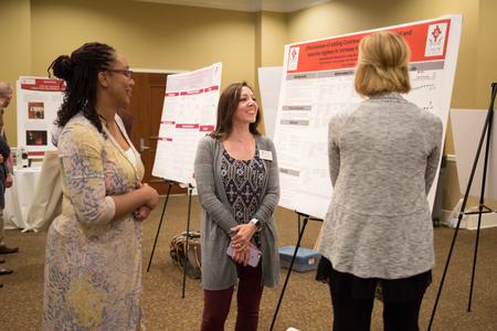 Students and faculty check out the posters at the annual Scholarship Symposium. - Photo by Kristi McMurry Woody