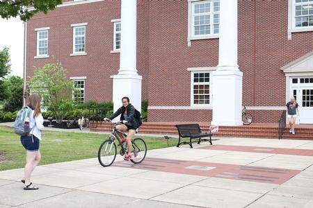 Students walk in front of White Hall between classes.  - Photo by Kristi McMurry Woody