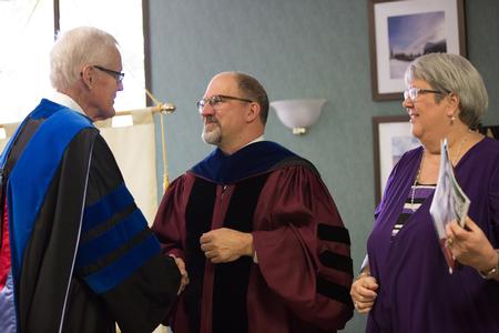 Scott Huelin and Wendy Glass stand in a receiving line after being named Faculty and Staff Member of the Year, respectively. - Photo by Kristi McMurry Woody