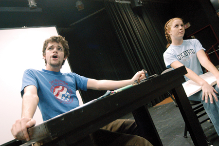 Freshman Aaron Shepherd feuds with junior Melody Pickerill in their one-act directed by senior Sarah Orr. - Photo by Jonathan Blair