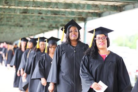 Graduate and BSOL students line up outside Oman Arena before spring commencement begins.  - Photo by Kristi McMurry Woody