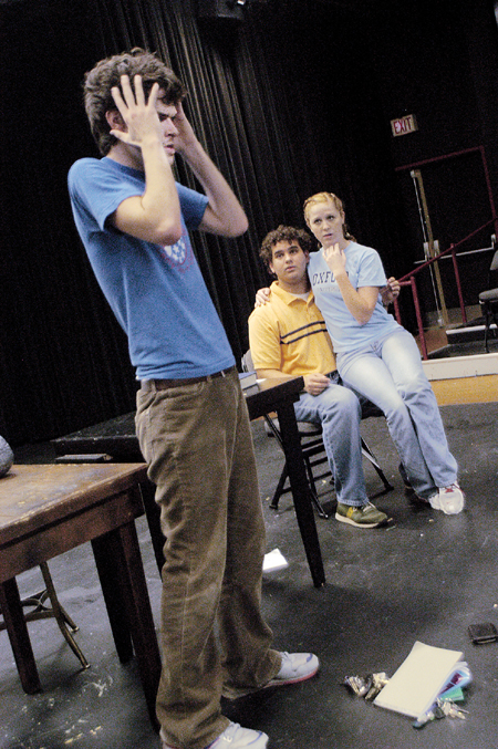 Aaron Shepherd prepares for yet another death scene as Melody Pickerill and Ryan Sidhom look on during "Variations on the Death of Trotsky," an upcoming student directed one-act. - Photo by Jonathan Blair