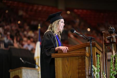Hannah Willis, senior class president, presents the class of 2017 gift, a study area by the PAC fountain, at the conclusion of spring commencement. - Photo by Kristi McMurry Woody