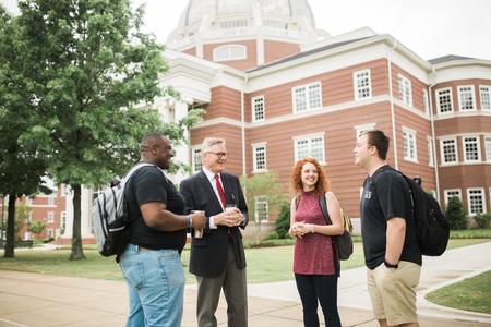 Justice Walker, Greg Jordan, Mattanah DeWitt and Trenton Holloway chat on a nice day outside The Logos. - Photo by Kristi McMurry Woody
