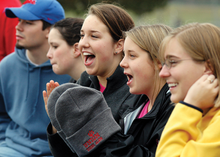 After eating turkey legs for lunch, crowds of sophomore fans and participants spent the afternoon cheering in the stands for their classmates on the field during the Turkey Bowl. - Photo by Kristen Hiller