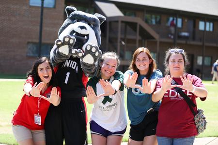 Students pose with Buster on move-in day. - Photo by Kristi McMurry Woody