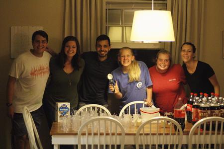 Members of the Residence Life team serve ice cream at their annual Progressive Snacking event. - Photo by Riley Boggs