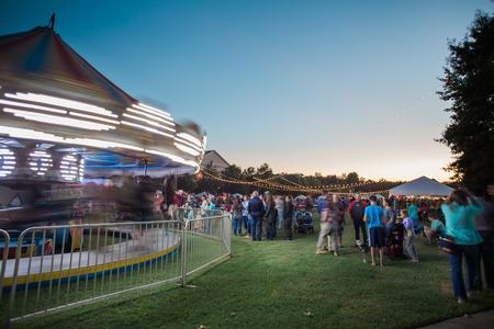 Families enjoy the carousel and other fun festivities during Family Weekend Union Night on the Great Lawn. - Photo by Kristi McMurry Woody