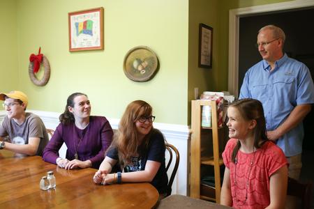 Students gather in the home of Beth and Andy Madison, Union faculty, for SAC's Be Our Guest.  - Photo by Kristi McMurry Woody