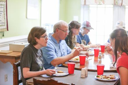 Beth and Andy Madison, Union faculty, host students during Be Our Guest.  - Photo by Kristi McMurry Woody