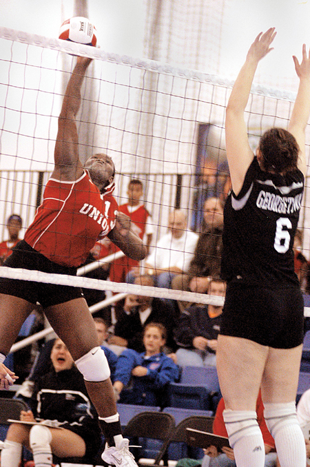 Senior Phylis Anyango, computer science major,
soars to new levels in order to make the play in regionals. - Photo by Kristen Nicole Sayres