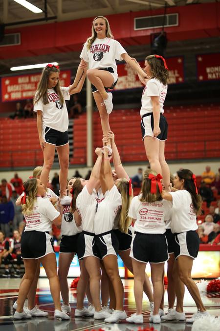 The bulldog cheerleaders build a pyramid during Bulldog Madness. - Photo by Kristi McMurry Woody