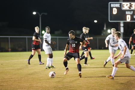 Andre Silva takes the ball from his Ouachita Baptist opponents during a game. - Photo by Kristi McMurry Woody