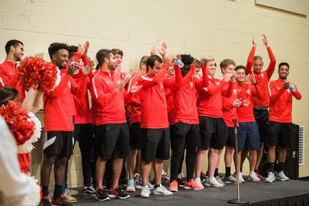 Bulldog soccer players cheer as they are introduced during the homecoming pep rally.  - Photo by Kristi McMurry Woody
